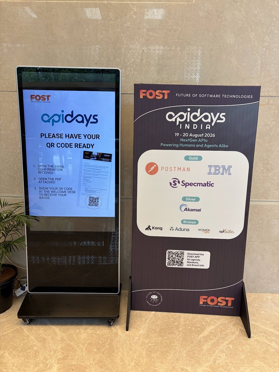 An information board and sponsor boards set up near the registration desk